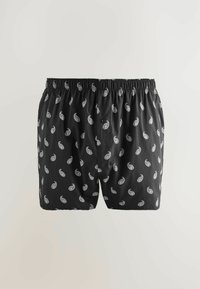 Schwarze Boxershorts aus leichtem Stoff, mit einem weißen paisley-muster und einem elastischen Bund mit einem einzelnen Knopfverschluss.