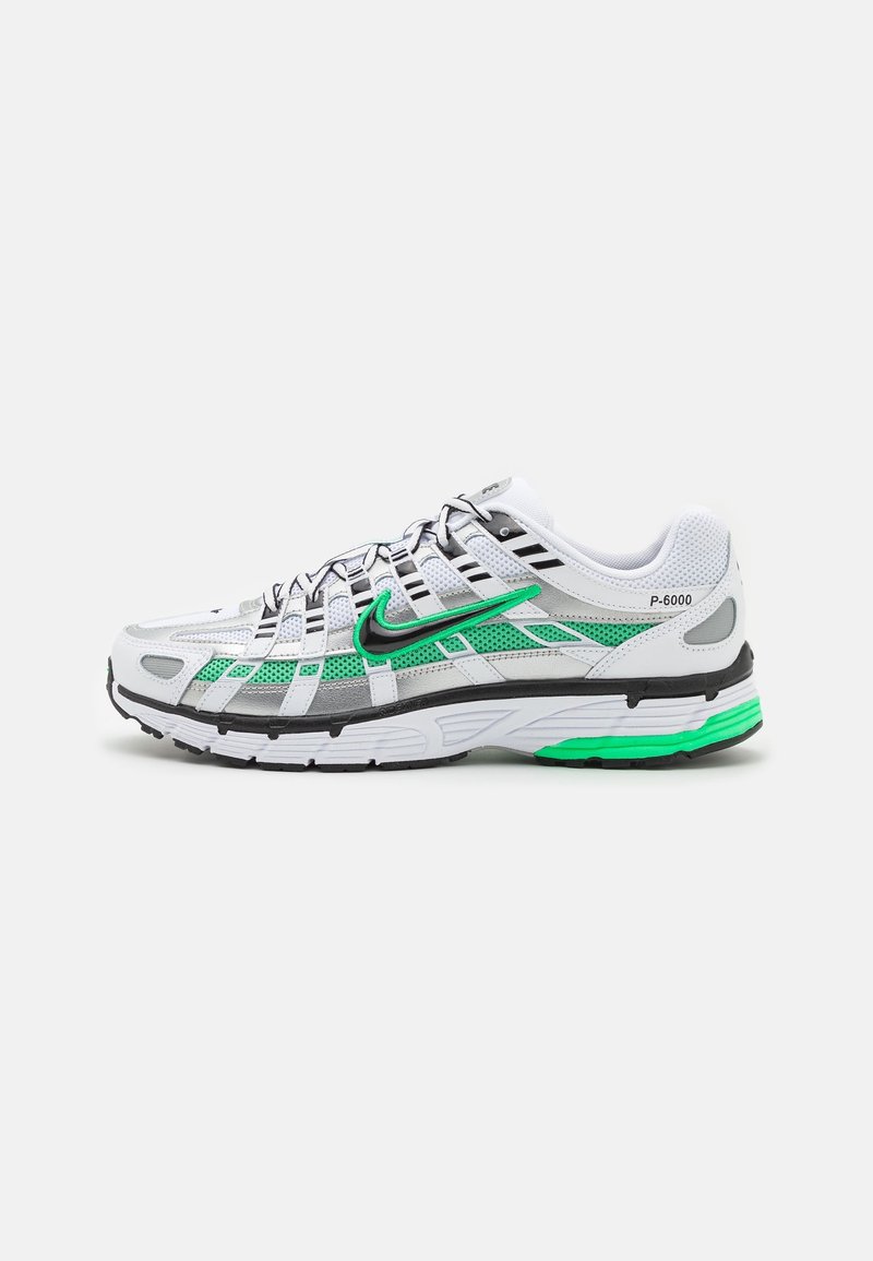 Baskets Nike P-6000 blanches et vertes avec détails noirs, empiècements en mesh et lacets, vues de côté sur fond uni.