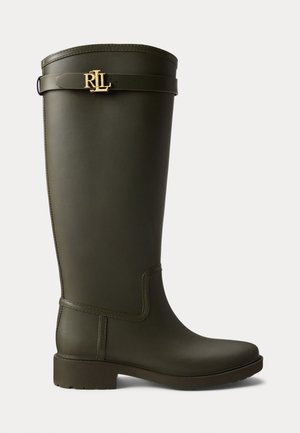 Knee-high, olive green rubber boot with a smooth texture, block heel, and a gold logo accent on a strap at the top.