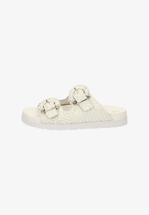 Sandales à glissière blanches en tissu tissé avec deux boucles circulaires. Matériau doux, semelle plate, dessus texturé et design minimaliste.