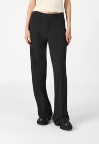 Black tailored trousers with a straight leg design, featuring a front button closure and side pockets, made from smooth fabric.