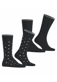 Schwarze Socken mit kontrastierenden grauen Akzenten. Zwei Paare weisen ein Muster aus weißen und grauen Formen auf, eines ist einfarbig schwarz. Stretchiger Baumwollmix.