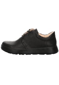 Chaussure en cuir noir avec un bout rond, un laçage et une surface texturée. Présente une semelle en caoutchouc flexible pour le confort et l'adhérence.