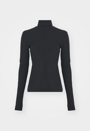 Black ribbed turtleneck top with long sleeves, fitted shape, smooth texture, and subtle stretch, designed for comfort and layering.