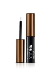 Produit Maybelline Tattoo Brow dans un tube noir avec un capuchon doré. Présente un applicateur blanc. Texte sur le tube en blanc et noir.