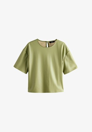 Bluse mit kurzen Ärmeln in Hellgrün, mit rundem Ausschnitt und einem Schlüssellochverschluss auf der Rückseite. Glatte Struktur, lockere Passform.