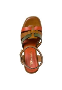 Leather sandal with multicolor straps in orange, green, and brown. Features a chunky heel, adjustable ankle strap, and textured insole.