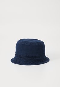 Navy blue bucket hat made of soft fabric, featuring a round crown, wide brim, and subtle texture. No visible patterns or embellishments.