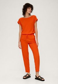 s.Oliver Tracksuit bottoms - dunkelorange