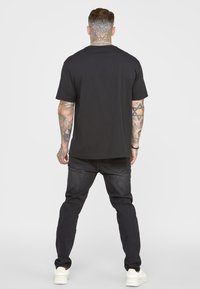 SIKSILK PATCH WORK DISTRESSED - Calças de ganga justas - washed black