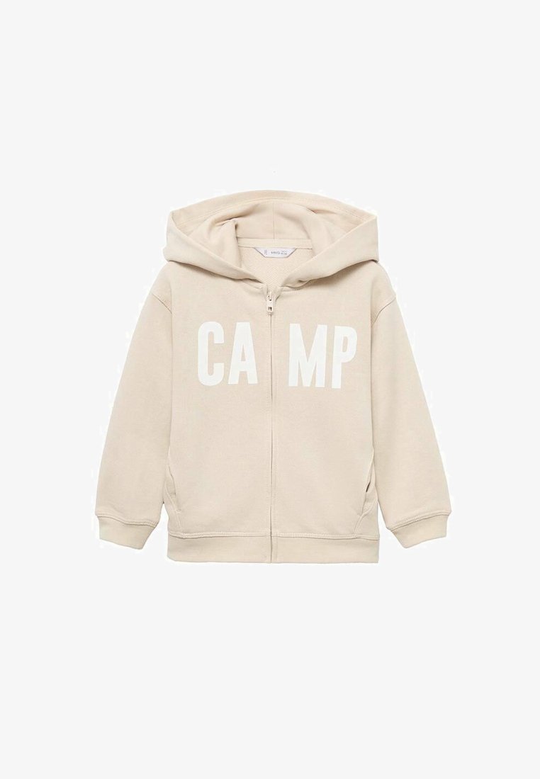 Bežová mikina na zips s kapucňou, s nápisom "CAMP" v tučných bielych písmenách na prednej strane. Vyrobená z mäkkej zmesovej bavlny.