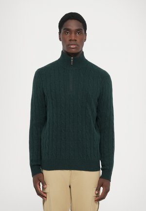 Dark green cable-knit sweater with a high collar and a half zipper. Ribbed cuffs and hem provide a textured finish. Simple and classic design.