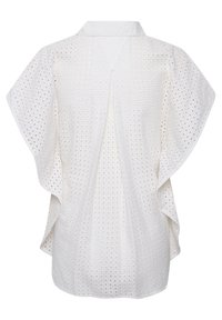 Blusa bianca con un motivo tessuto testurizzato, colletto e maniche ampie e fluide. Il tessuto è leggero e traspirante.