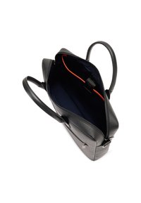 Black textured leather tote bag with double handles, open top zipper, and navy interior featuring a red-edged inner pocket.