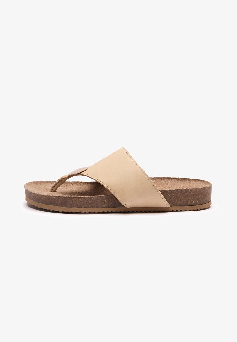 Sandale beige en cuir avec une large bride, semelle intérieure en liège rembourrée et semelle en caoutchouc, vue de profil sur fond blanc.