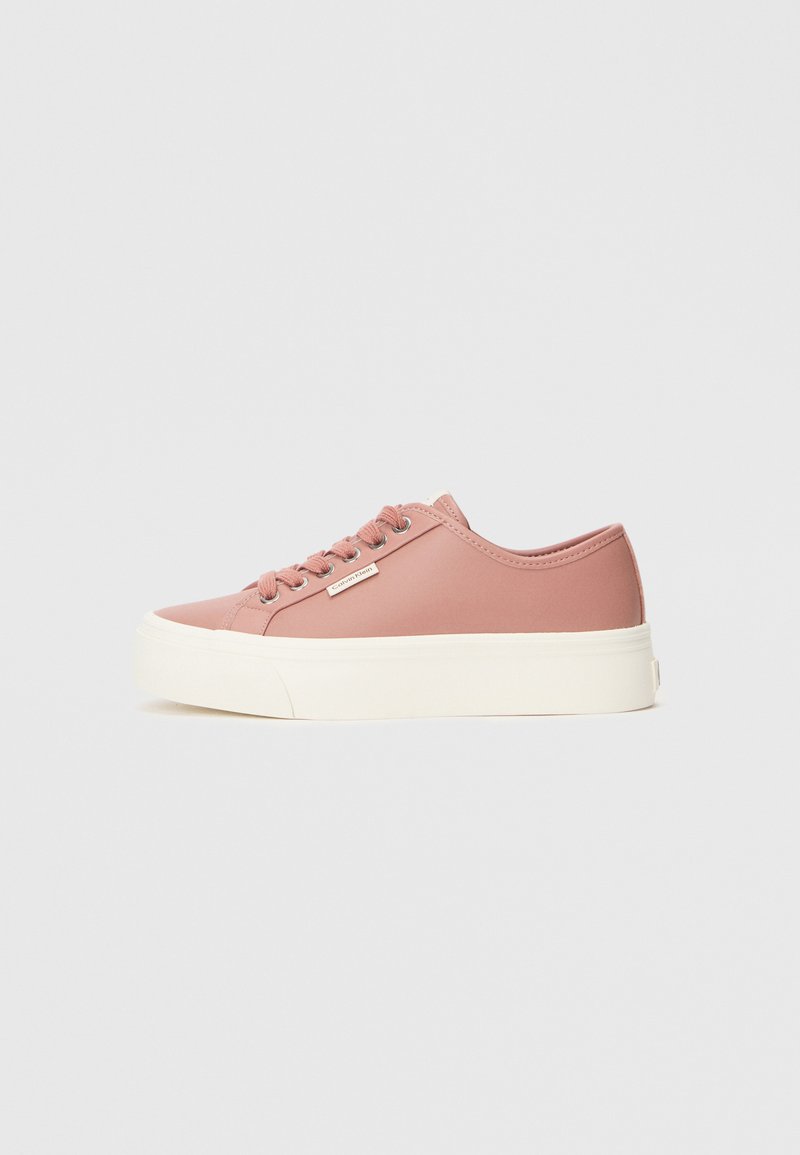 Pink synthetic sneakers with rounded toe, white sole, and matching laces. Features a small logo and smooth texture.