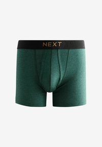 Zelene hlače za boks, narejene iz mehke tkanine, s črnim elastičnim pasom. Pas ima zlato blagovno znamko "NEXT."