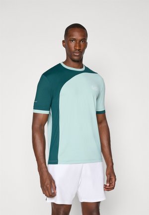 Short-sleeve athletic t-shirt in teal and light blue, featuring a color-block design. Made from a breathable fabric with a round neckline.