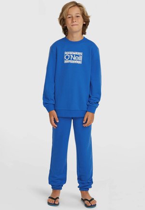 Modra jopa z dolgimi rokavi in ujemajoče trenirka iz mehke tkanine, s poudarjenim logotipom O'Neill, rebrastimi manšetami in elastičnim pasom.