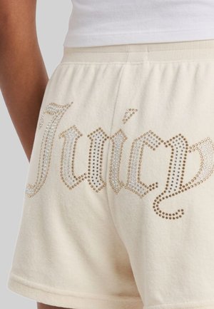 Pantaloncini beige Juicy Couture con fascia elastica in vita e logo "Juicy" in stile gotico decorato con strass sul retro.