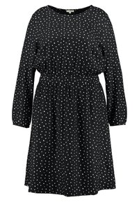 Schwarzes Kleid mit langen Ärmeln und weißen Punkten, ausgestattet mit einem elastischen Taillenbund für einen gerafften Effekt und einer lockeren Silhouette.