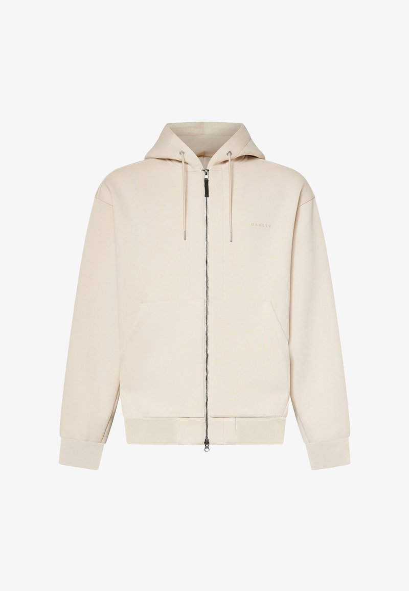 Beiger Kapuzenpullover mit durchgehendem Reißverschluss, Kordelzugkapuze, langen Ärmeln, Fronttaschen und dezentem "Oakley"-Logo auf der linken Brust.