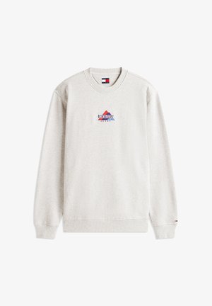 Sweat-shirt gris clair, col rond, poignets et ourlet côtelés, présente un logo triangulaire coloré avec "tommy" et "JEANS" imprimés en dessous.