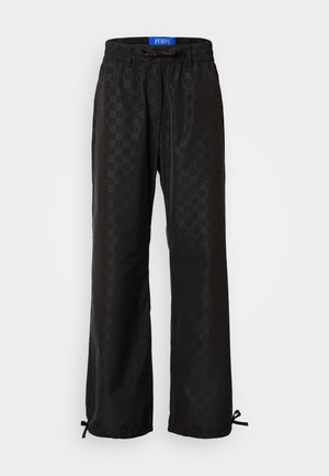 Black trousers featuring a subtle hexagon pattern, elastic waistband with drawstring, and adjustable cuffs with ties at the hem.
