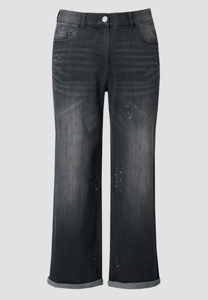 Schwarze Jeans mit weitem Bein und aufgerollten Säumen, vorderem Knopfverschluss, verwaschener Optik und kleinen Used-Details.