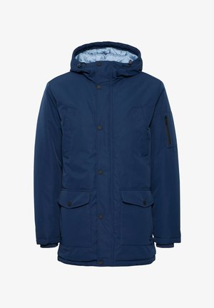 Mörkblå vadderad jacka med huva, med tryckknappar, två framfickor och en zip-ficka på vänster ärm. Kviltad foder.