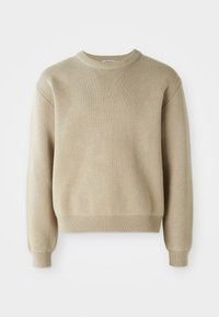 Beige striktrøje med rund halsudskæring, lange ærmer og ribbestrikkede manchetter og kant. Har et struktureret mønster i hele stoffet.