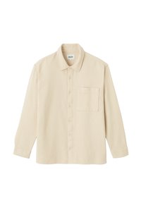 Chemise beige à boutons avec un tissu texturé, dotée d'un col, de manches longues et d'une seule poche poitrine. Motif à carreaux subtil sur l'ensemble.