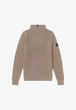 Beige ribbeltrui met een hoge kraag en een kwart rits. Voorzien van lange mouwen en een klein logo-opzoekje op de linker mouw.