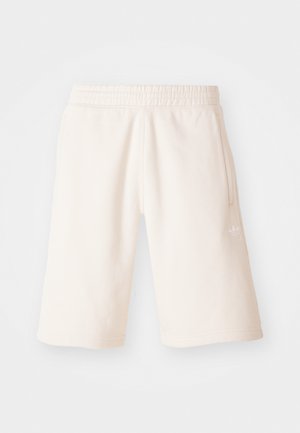 Cremefarvede bomuldsshorts med elastisk talje, sidelommer og et diskret logo på venstre ben. Glat tekstur og knælængde design.