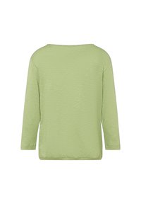 Langärmliges Oberteil in Hellgrün, mit lockerer Passform und strukturiertem Stoff. Der Ausschnitt ist weit und rund, mit genähten Säumen an den Bündchen und am unteren Saum.