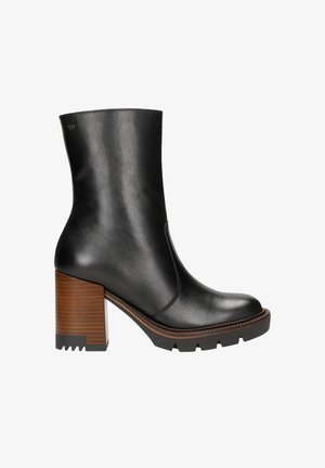 Black leather ankle boot with a chunky brown block heel, smooth finish, rounded toe, and rubber sole featuring grip detailing.