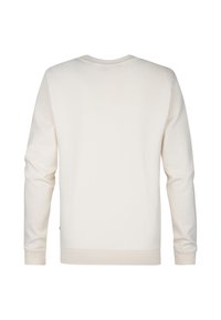 Crème-kleurige sweatshirt met lange mouwen, ronde hals, ribbels aan de mouwen en onderkant. Gemaakt van zachte stof met een gladde textuur. Geen zichtbare logo's.