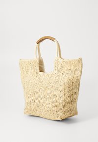 Sac fourre-tout en paille tissée de couleur beige clair avec une finition texturée, doté de deux poignées en corde solide et d'un design sans fermeture.