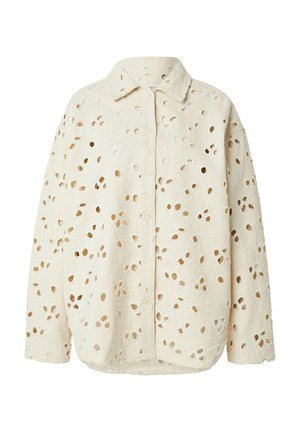 Beige long-sleeve button-up shirt with a floral eyelet pattern and a classic collar.