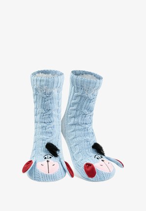 Blaue Stricksocken mit einem strukturierten Kabelmuster und einem Cartoon-Tiergesicht-Design, das Ohren und ein Mähnendetail umfasst.
