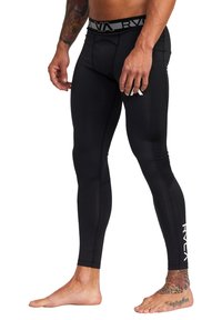 Sorte atletiske leggings med en tætsiddende pasform, der har en grå talje med logo og en hvid logoaccent på underbenet. Glat tekstur.
