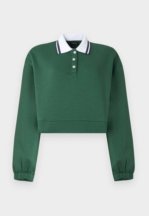 Σκούρα πράσινη μακρυμάνικη κοντή φούτερ μπλούζα με λευκή γιακά με κουμπιά και ελαστικές μανσέτες στα μανίκια, σε απλό φόντο.