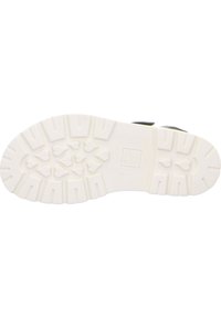 Podešev boty v bílé gumě s texturovaným vzorkem obsahujícím srdíčkové motivy, navržená pro přilnavost a odolnost.