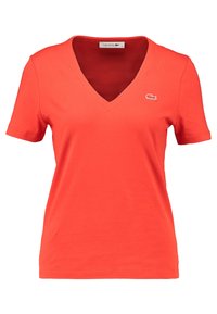 T-Shirt in cotone rosso con scollo a V, maniche corte e un piccolo logo ricamato sul lato sinistro del petto. Tessuto liscio con un design aderente.