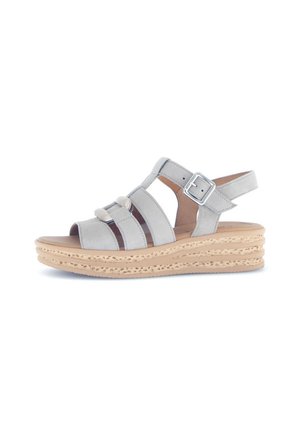 Light gray leather sandals with multiple straps, adjustable buckle, and a textured platform sole in a natural color.