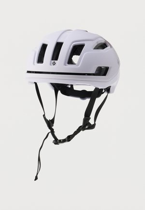 White cycling helmet with vented design, adjustable black straps, and a matte finish. Features a prominent logo on one side.