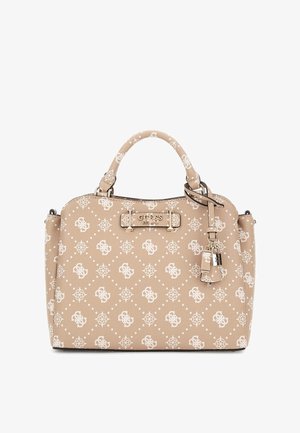 Beige Guess handbag with white logo pattern, dual top handles, metal logo plaque, and decorative padlock charm on right side.