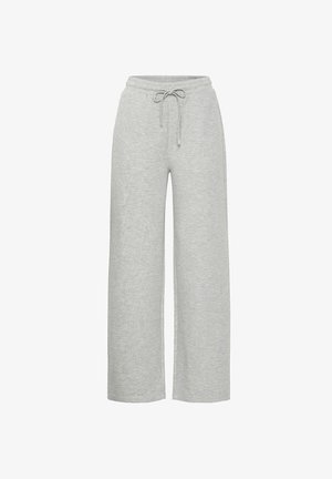 Heledad hallhallik, mugavad dressipüksid on valmistatud pehmest, tekstureeritud kangast. Neil on elastne vöökoht ja reguleeritav pael.