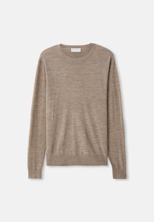 Beiger Pullover aus feinem Strickmaterial. Mit Rundhalsausschnitt, langen Ärmeln und gerippten Bündchen sowie Saum. Einfaches und zeitloses Design.