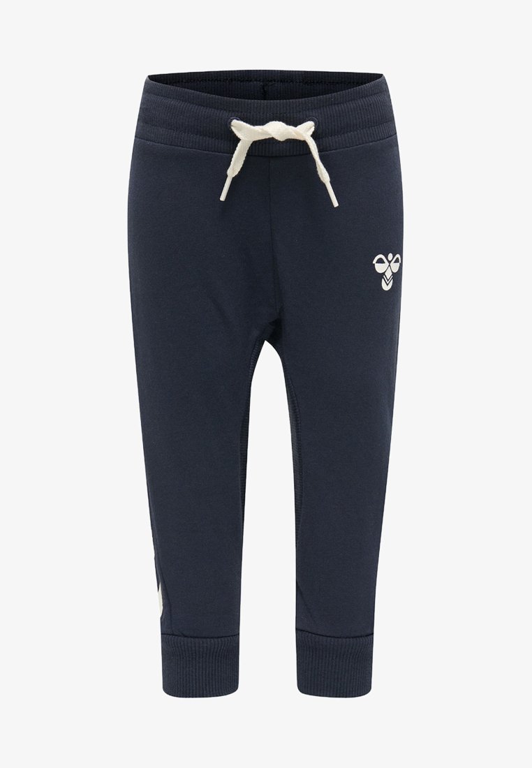 Mørkeblå sweatshirtbukser med elastisk taljebånd og cremefarvet snoretræk. Har ribbede manchetter og et hvidt logo på siden.